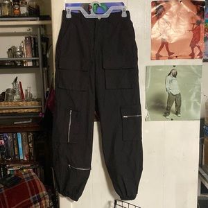 Black baggy cargo like pants. Size small faded rosé essentials